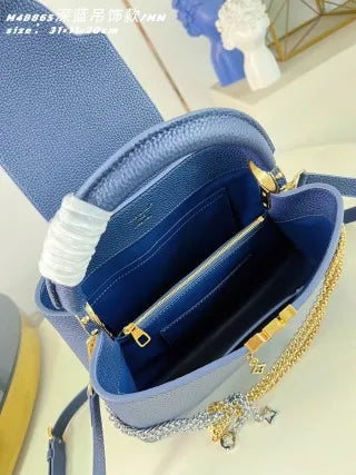 Capucines MM Taurillon Leather 12.2 in Handbag M48865