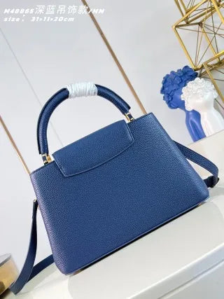 Capucines MM Taurillon Leather 12.2 in Handbag M48865