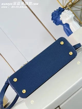 Capucines MM Taurillon Leather 12.2 in Handbag M48865