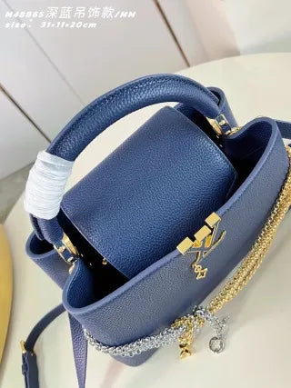 Capucines MM Taurillon Leather 12.2 in Handbag M48865