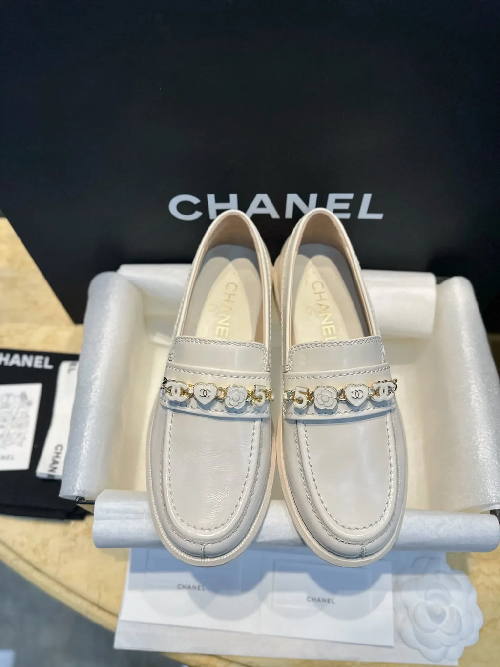 Chanel 24A Enamel Buckle White Loafers 543542