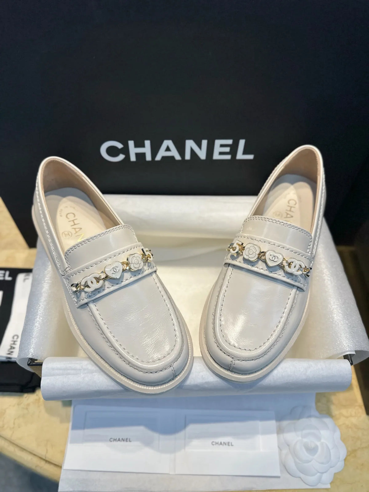 Chanel 24A Enamel Buckle White Loafers 543542
