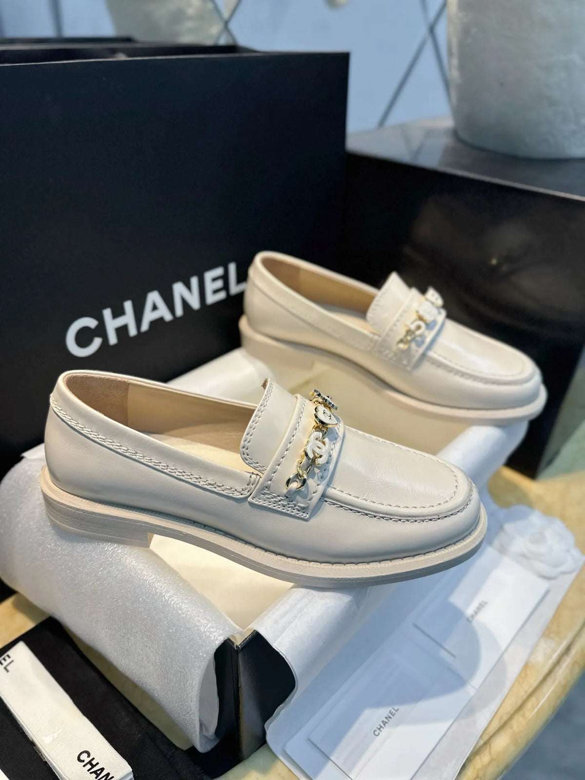 Chanel 24A Enamel Buckle White Loafers 543542