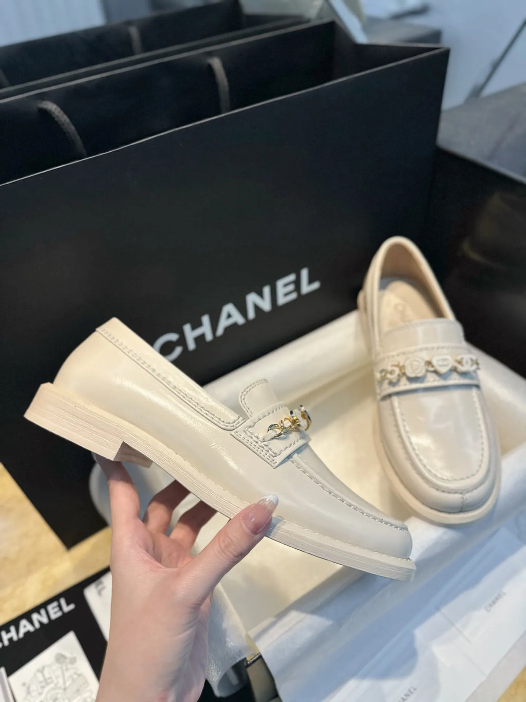 Chanel 24A Enamel Buckle White Loafers 543542