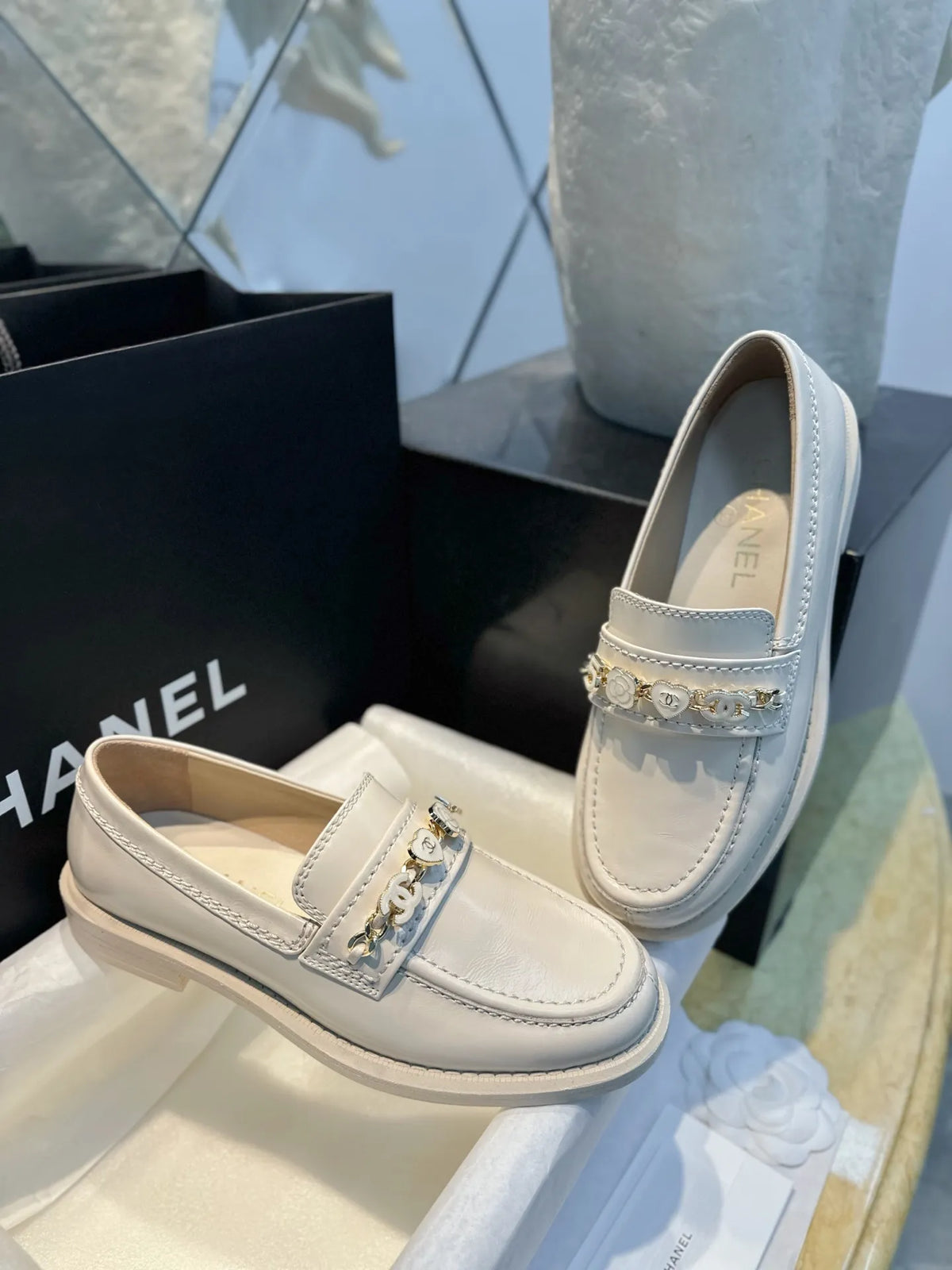 Chanel 24A Enamel Buckle White Loafers 543542