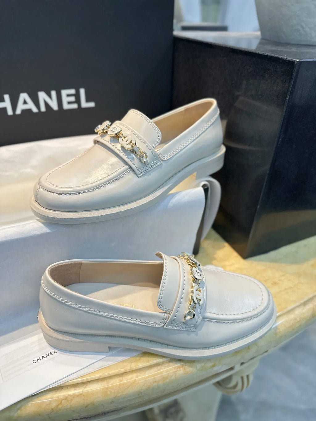 Chanel 24A Enamel Buckle White Loafers 543542