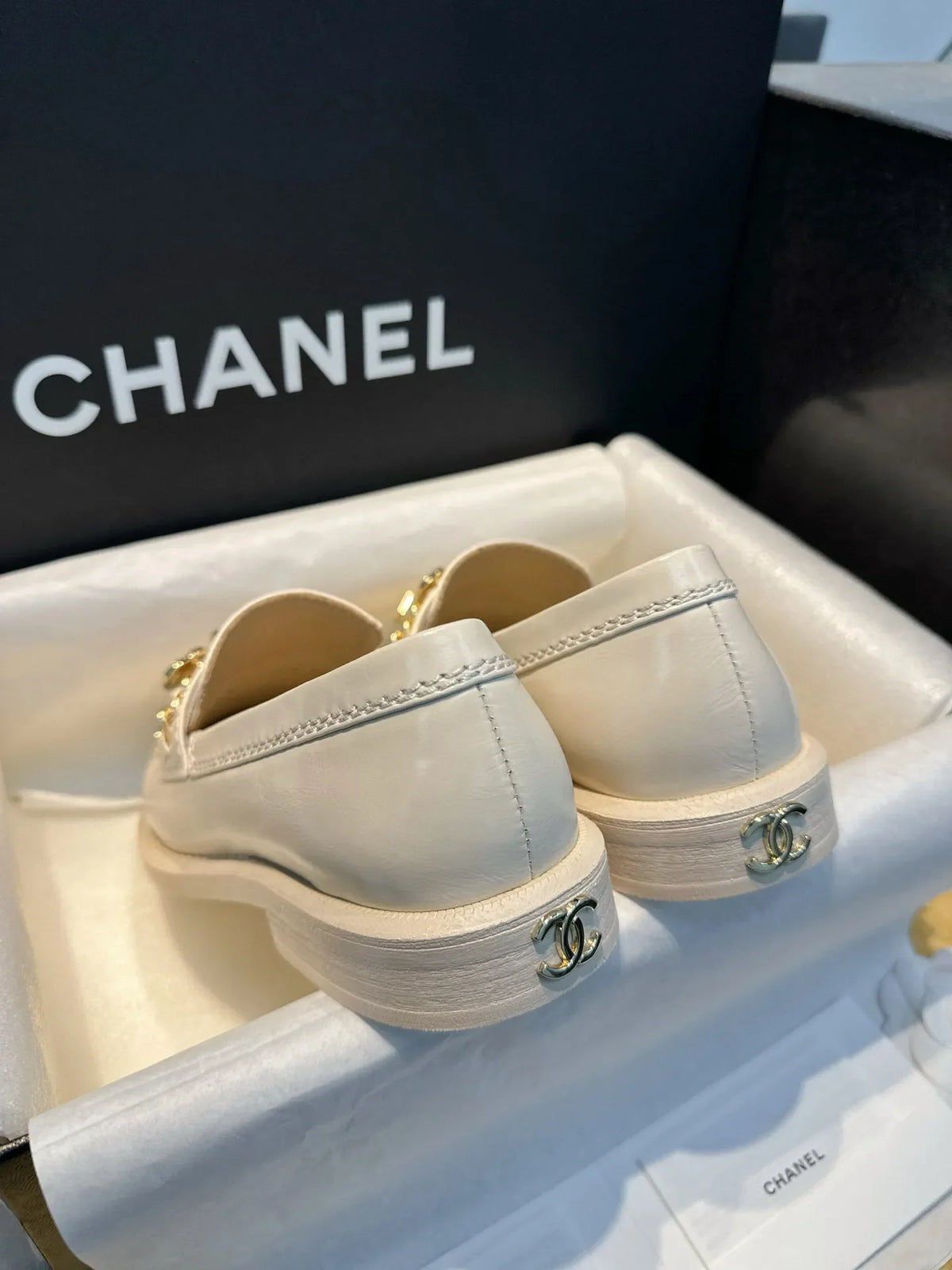 Chanel 24A Enamel Buckle White Loafers 543542